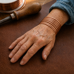 Set of simple copper bracelets by Livia